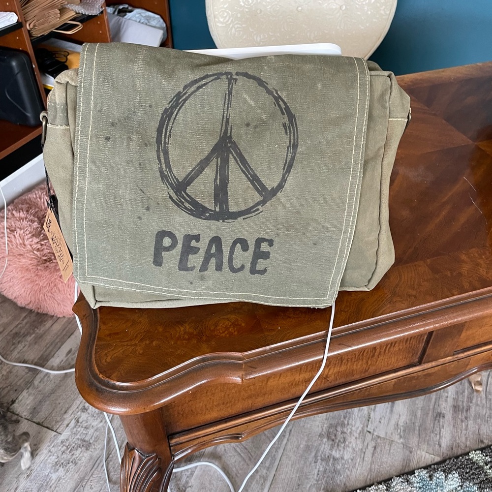 Cross body purse made out recycled army tents.